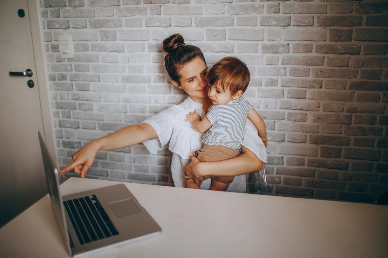Mother with a child at a laptop