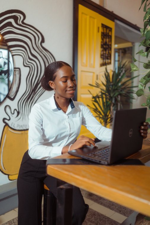 Young woman at a laptop in an office