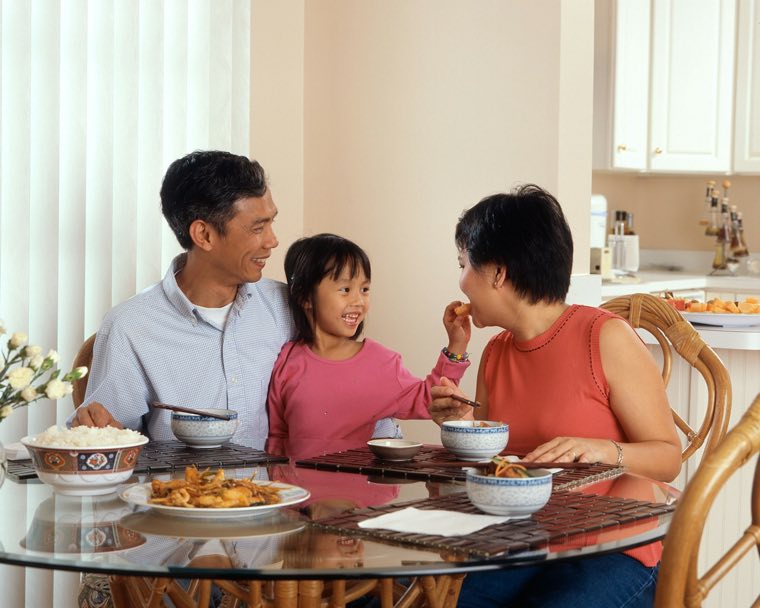 Family talking at a kitchen table