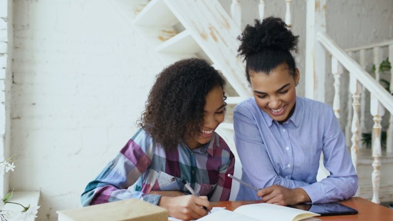 Two students studying together at a table
