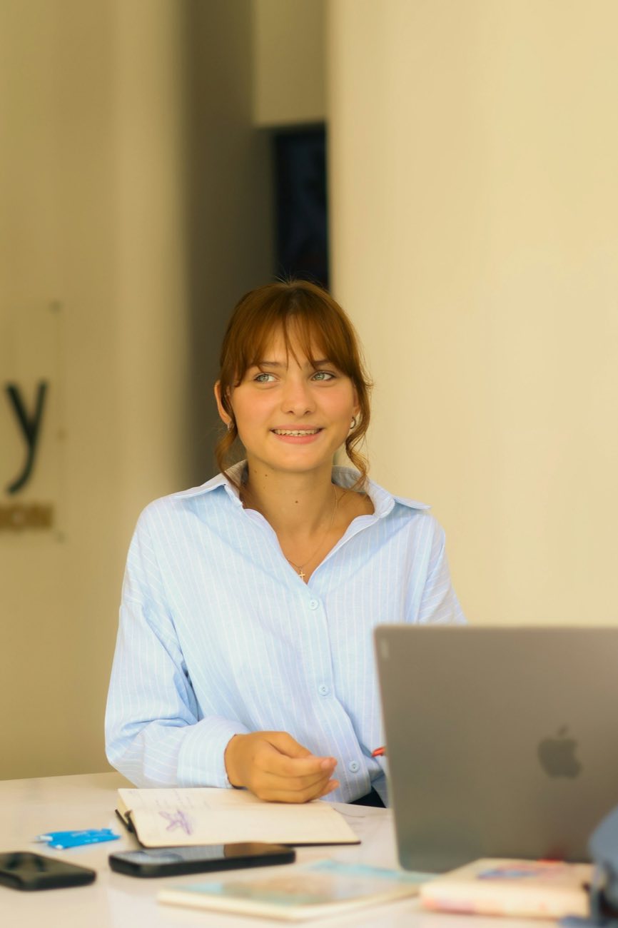Smiling woman in a white shirt